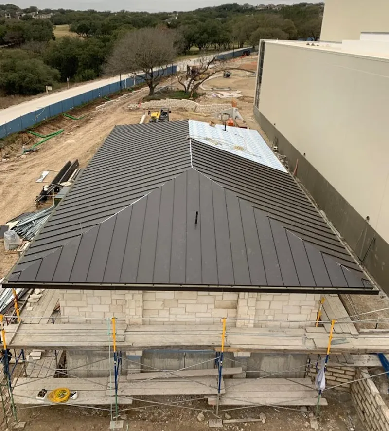 Metal roof new construction with scaffolding in Four Corners